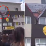 сняв плакат Эрдогана